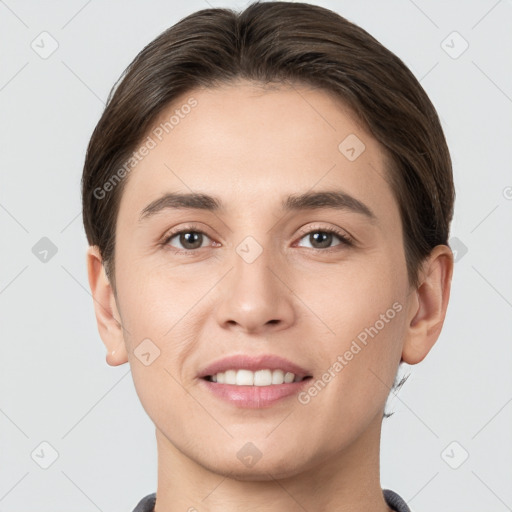 Joyful white young-adult female with short  brown hair and brown eyes