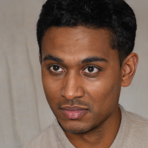 Neutral black young-adult male with short  black hair and brown eyes