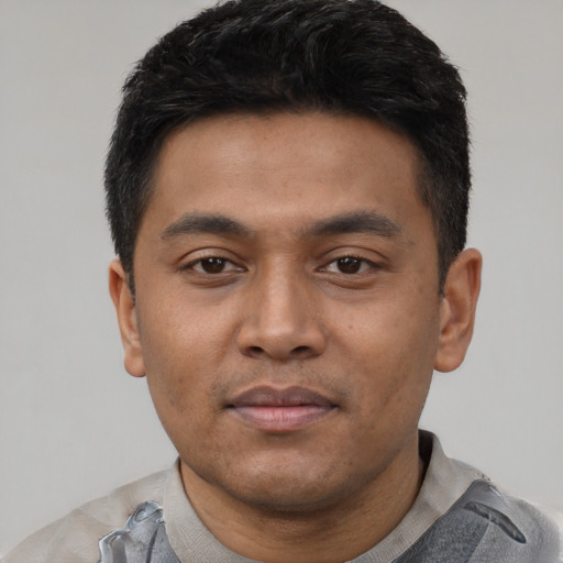 Neutral latino young-adult male with short  black hair and brown eyes