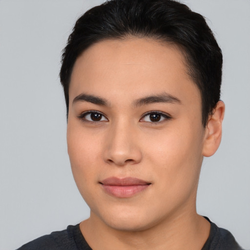 Joyful asian young-adult female with short  black hair and brown eyes
