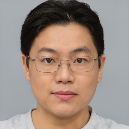 Neutral asian adult male with short  brown hair and brown eyes