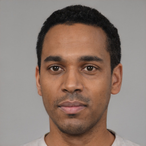 Neutral black young-adult male with short  black hair and brown eyes