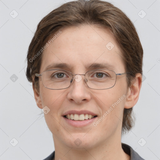 Joyful white adult female with short  brown hair and grey eyes