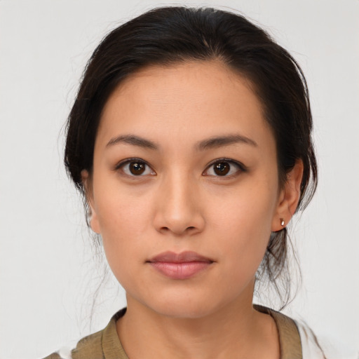 Neutral latino young-adult female with medium  brown hair and brown eyes