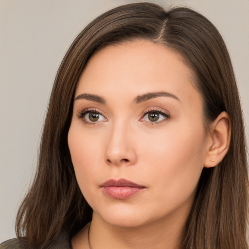 Neutral white young-adult female with long  brown hair and brown eyes