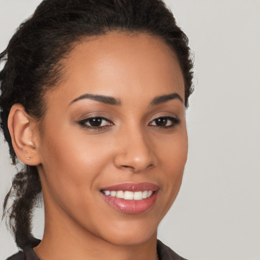 Joyful latino young-adult female with short  brown hair and brown eyes