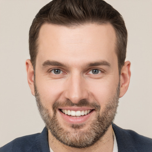 Joyful white young-adult male with short  brown hair and brown eyes