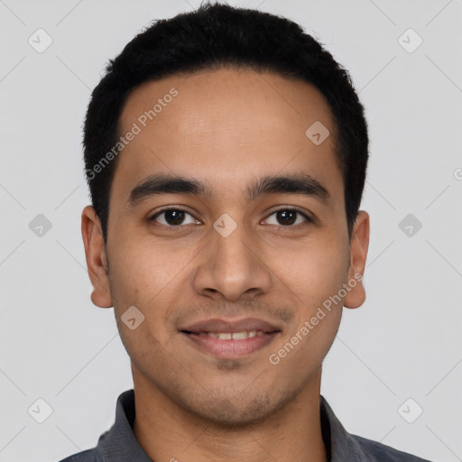 Joyful latino young-adult male with short  black hair and brown eyes