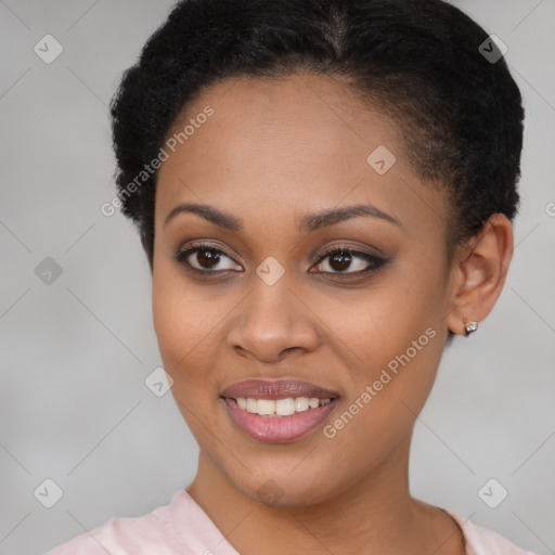 Joyful black young-adult female with short  brown hair and brown eyes