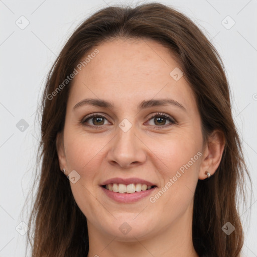 Joyful white young-adult female with long  brown hair and grey eyes