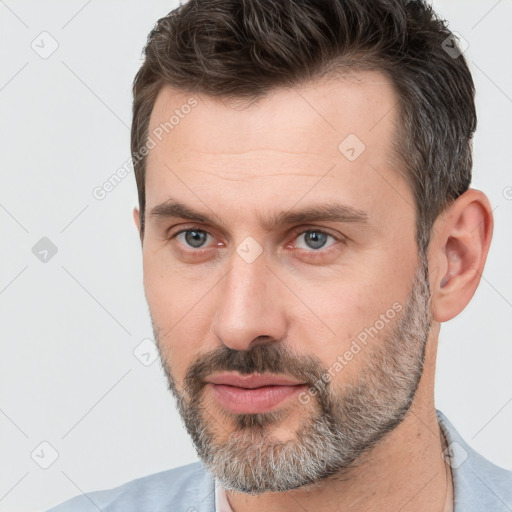 Neutral white adult male with short  brown hair and brown eyes