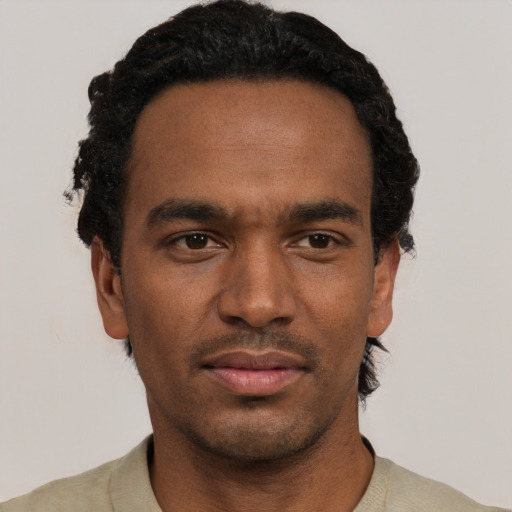 Neutral black young-adult male with short  black hair and brown eyes