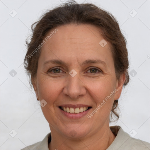 Joyful white adult female with short  brown hair and grey eyes