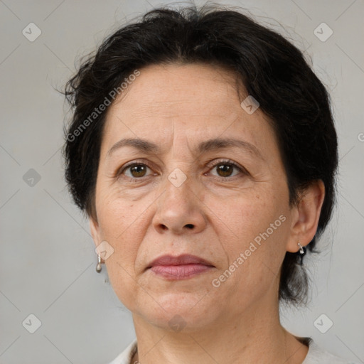 Joyful white adult female with medium  brown hair and brown eyes