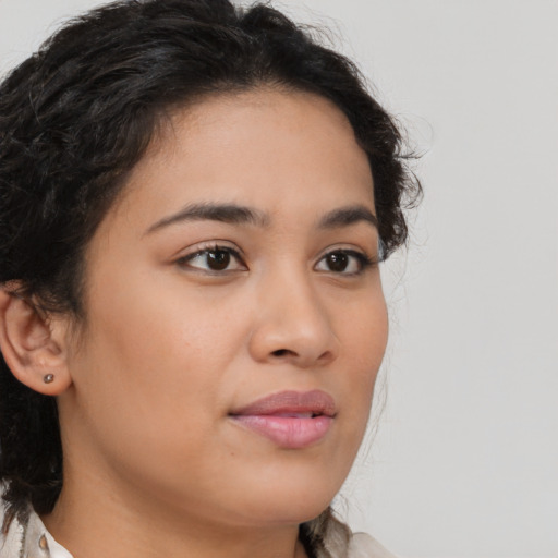 Neutral latino young-adult female with medium  brown hair and brown eyes