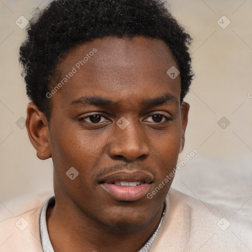 Joyful black young-adult male with short  brown hair and brown eyes