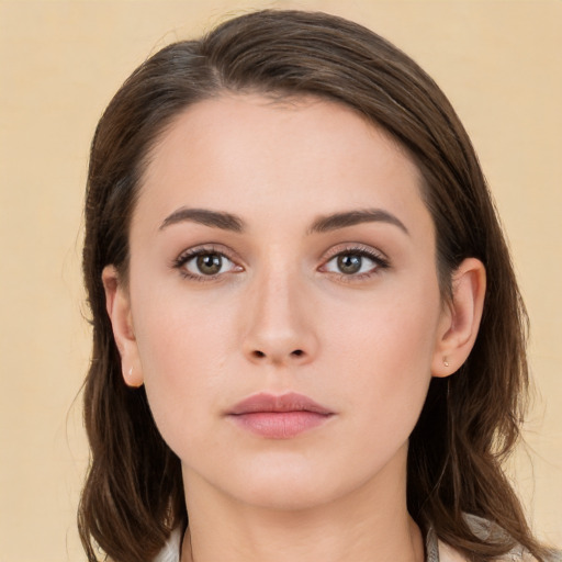 Neutral white young-adult female with long  brown hair and brown eyes