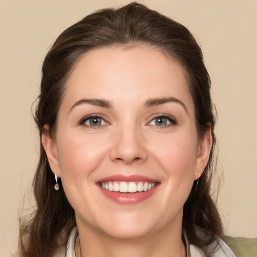 Joyful white young-adult female with medium  brown hair and brown eyes