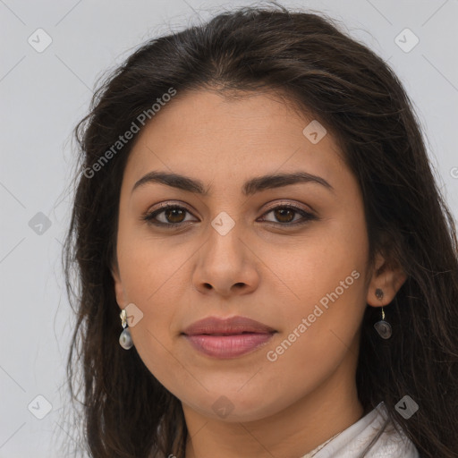 Joyful latino young-adult female with long  brown hair and brown eyes