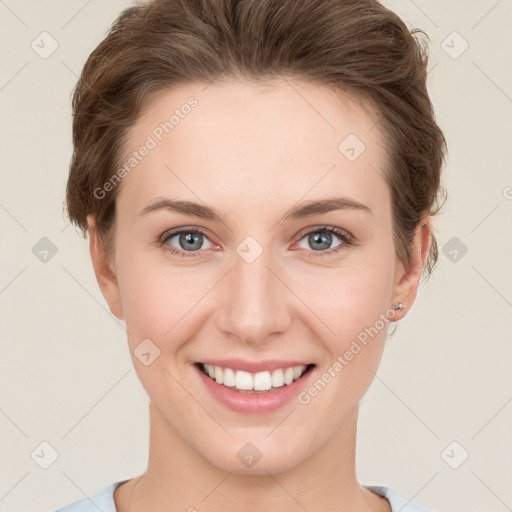 Joyful white young-adult female with short  brown hair and grey eyes