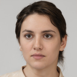 Neutral white young-adult female with medium  brown hair and brown eyes