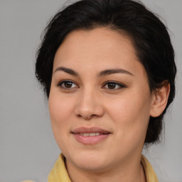 Joyful asian young-adult female with medium  brown hair and brown eyes