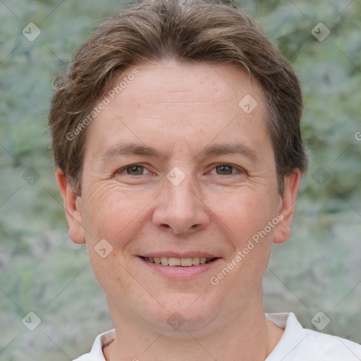 Joyful white adult male with short  brown hair and grey eyes