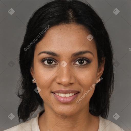 Joyful black young-adult female with medium  black hair and brown eyes