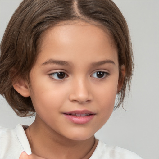 Joyful white child female with medium  brown hair and brown eyes