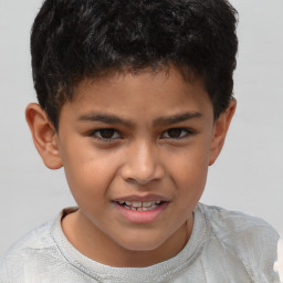 Joyful white child male with short  brown hair and brown eyes