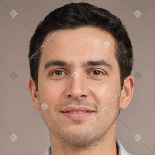 Joyful white young-adult male with short  black hair and brown eyes