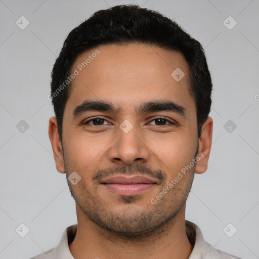 Joyful latino young-adult male with short  black hair and brown eyes