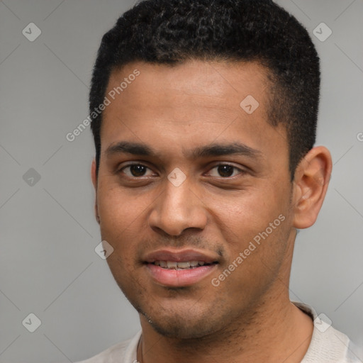 Joyful black young-adult male with short  black hair and brown eyes