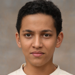 Joyful latino young-adult male with short  brown hair and brown eyes