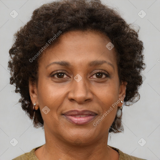 Joyful black adult female with short  brown hair and brown eyes