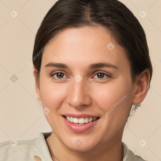 Joyful white young-adult female with medium  brown hair and brown eyes