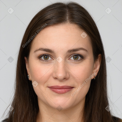 Joyful white young-adult female with long  brown hair and brown eyes