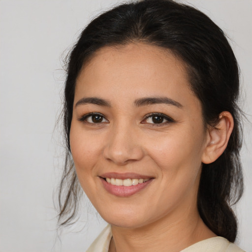 Joyful asian young-adult female with medium  brown hair and brown eyes