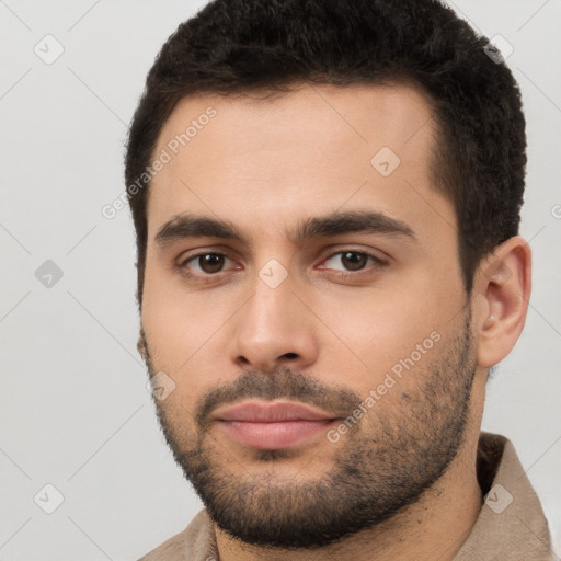 Neutral white young-adult male with short  brown hair and brown eyes