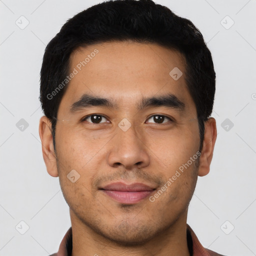 Joyful latino young-adult male with short  black hair and brown eyes