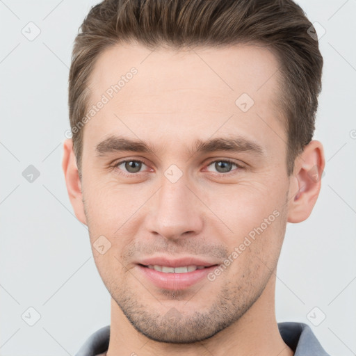 Joyful white young-adult male with short  brown hair and brown eyes