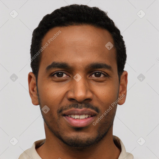 Joyful black young-adult male with short  black hair and brown eyes