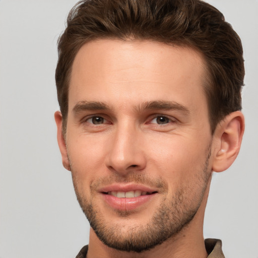 Joyful white young-adult male with short  brown hair and brown eyes