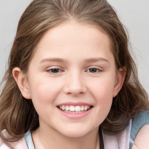 Joyful white child female with medium  brown hair and grey eyes