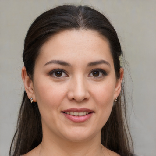 Joyful white young-adult female with medium  brown hair and brown eyes