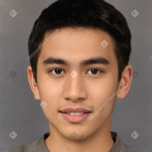 Joyful asian young-adult male with short  brown hair and brown eyes