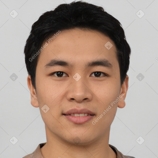 Joyful asian young-adult male with short  black hair and brown eyes