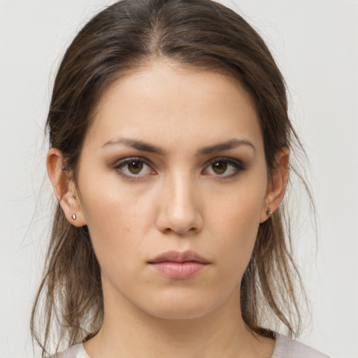 Neutral white young-adult female with medium  brown hair and brown eyes