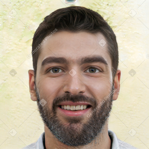 Joyful white young-adult male with short  black hair and brown eyes