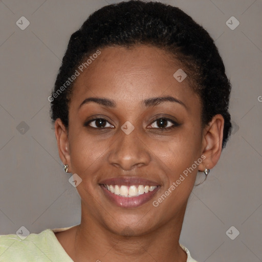 Joyful black young-adult female with short  brown hair and brown eyes